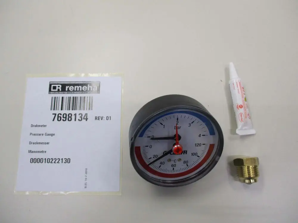 Remeha Druckmesser mit Messbereich von 0 bis 6 bar, abgebildet mit einer Dichtmasse und einem Anschlussstück, auf einem neutralen Hintergrund.